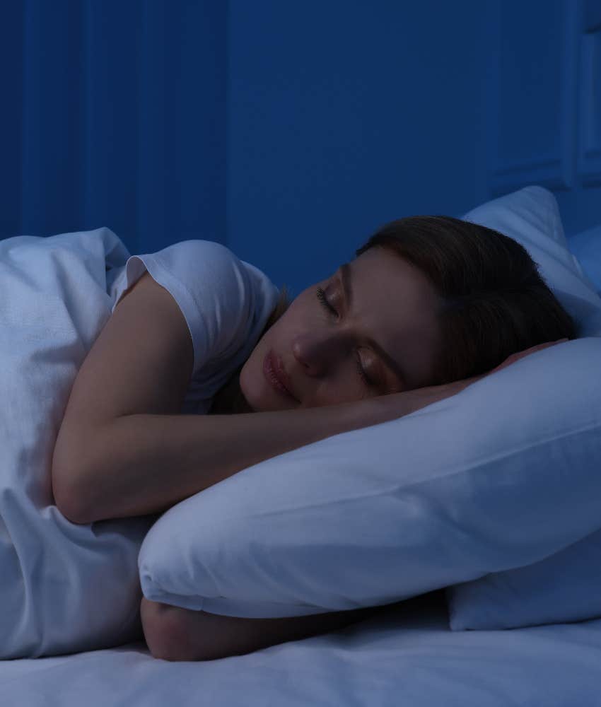 Your Brain May Be Telling You Something If You Fall Asleep In Less Than 10 Minutes woman sleeping soundly because she's sleep deprived