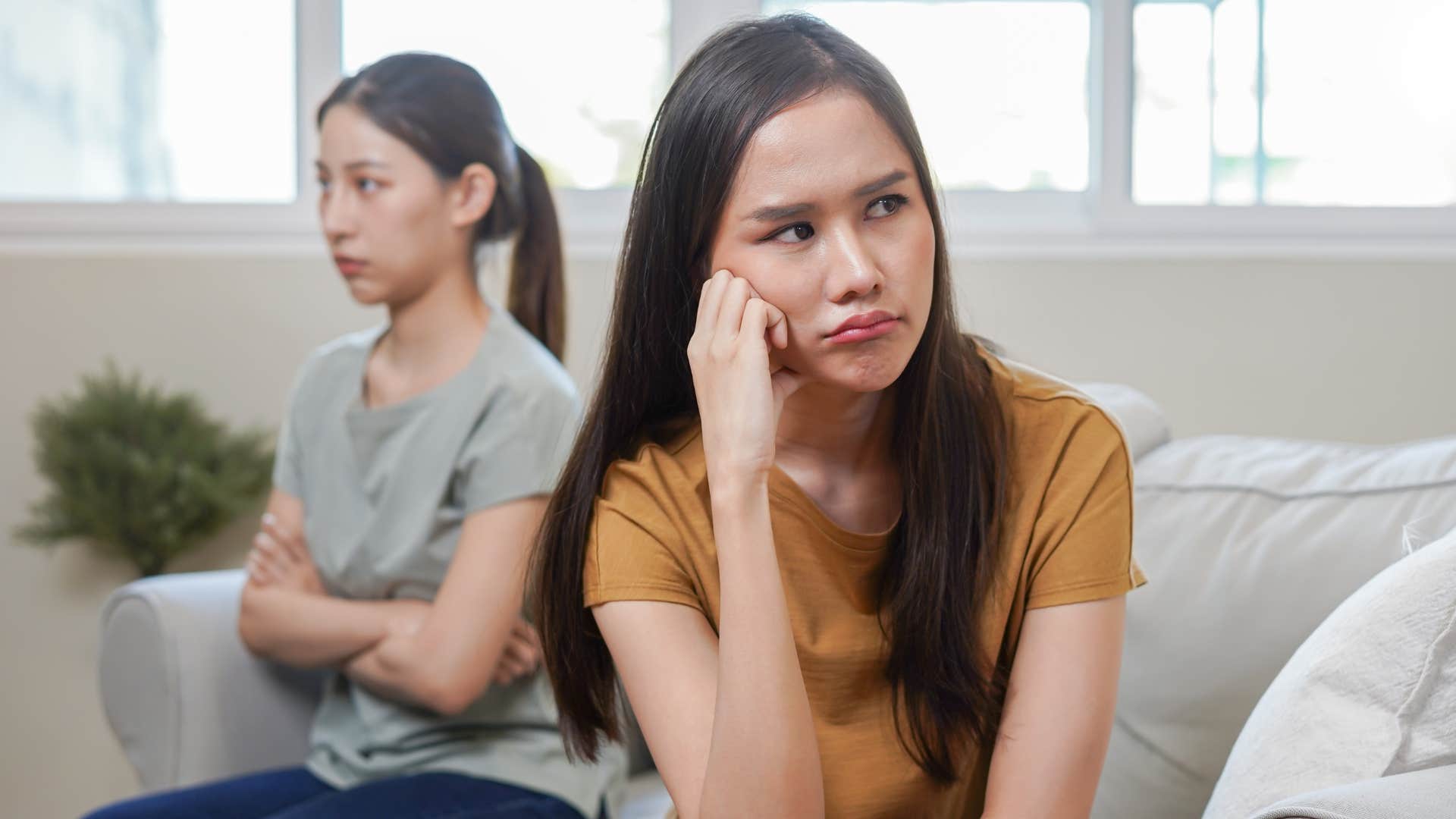 woman pulling away from friend