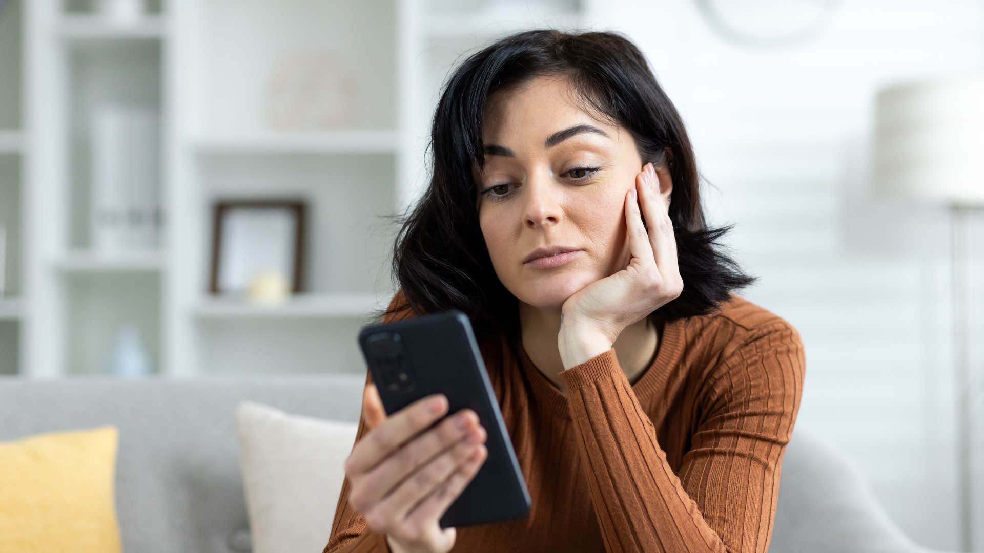 woman with no hobbies bored on her phone