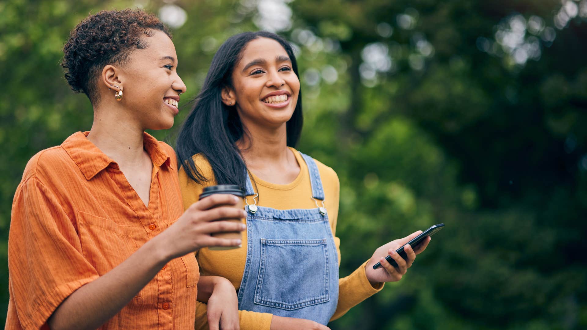 two women smiling walking together as new friends
