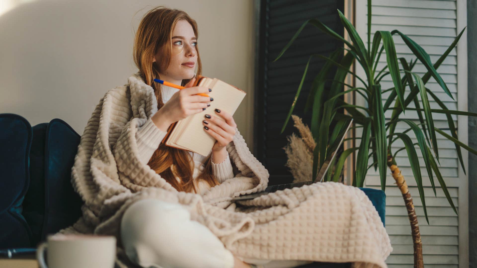 woman manifesting partner she's dreamed about by creating vision journal