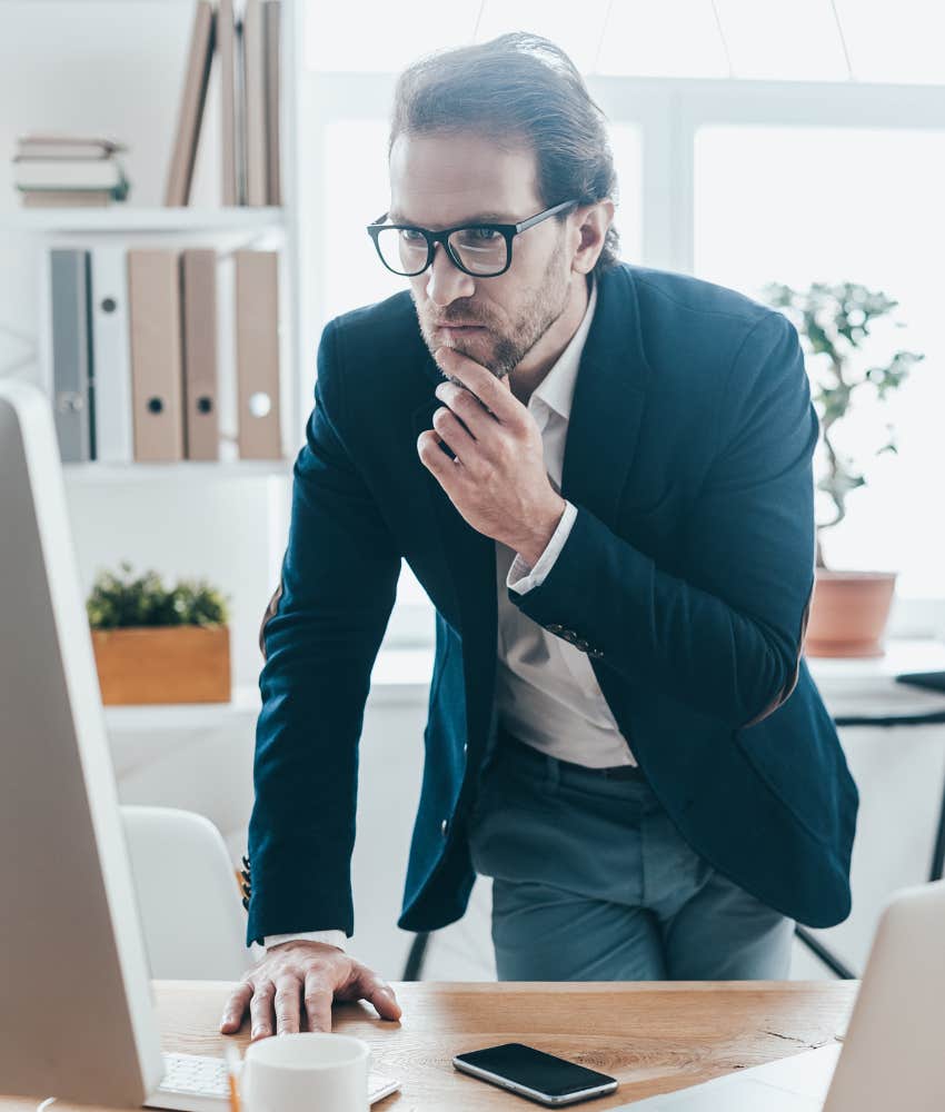 This Mindless Daily Habit Can Reveal Just How Stressed You Are At Work stressed-out worker mindlessly touching his face