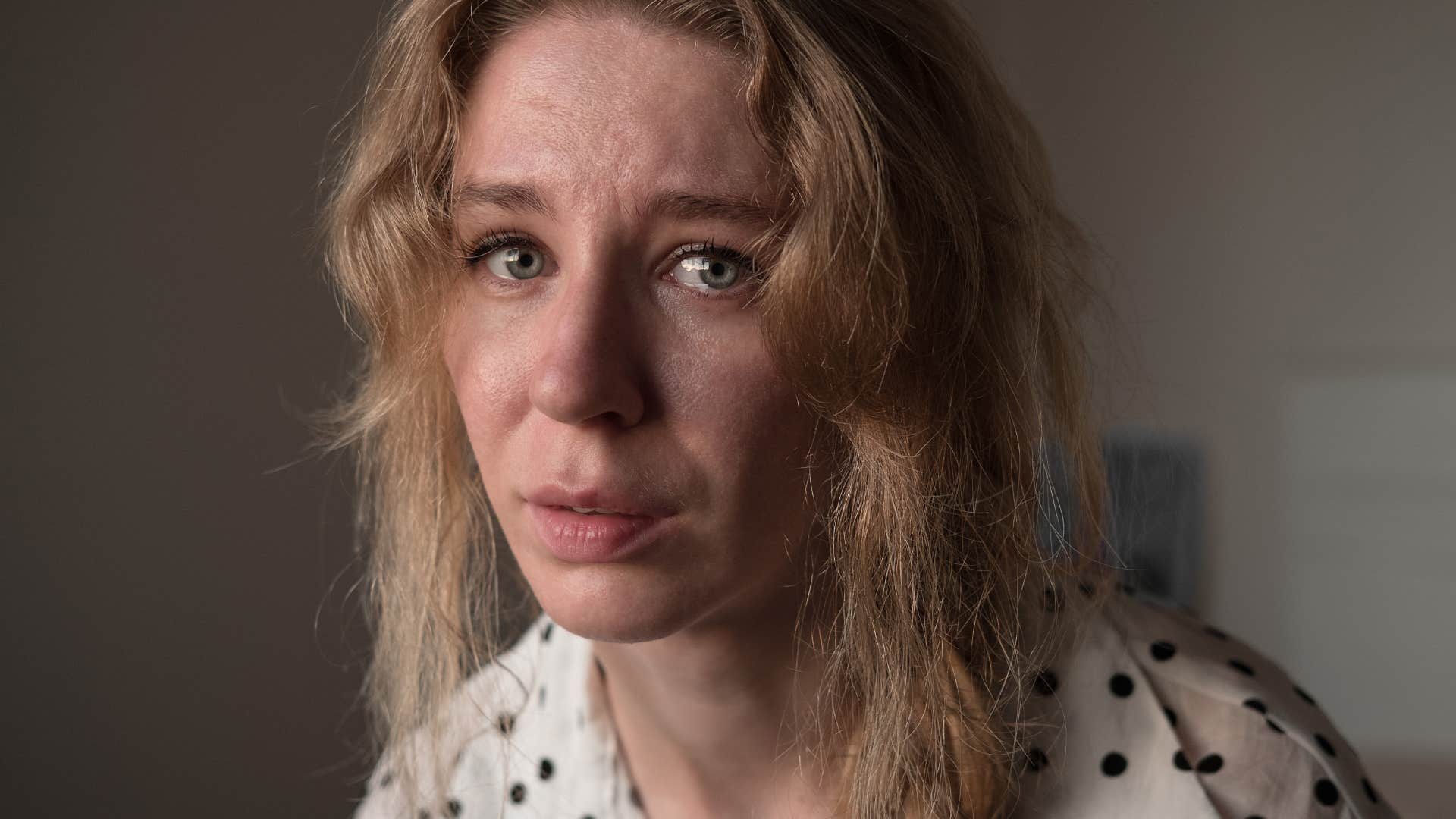 lonely woman looking upset tearing up