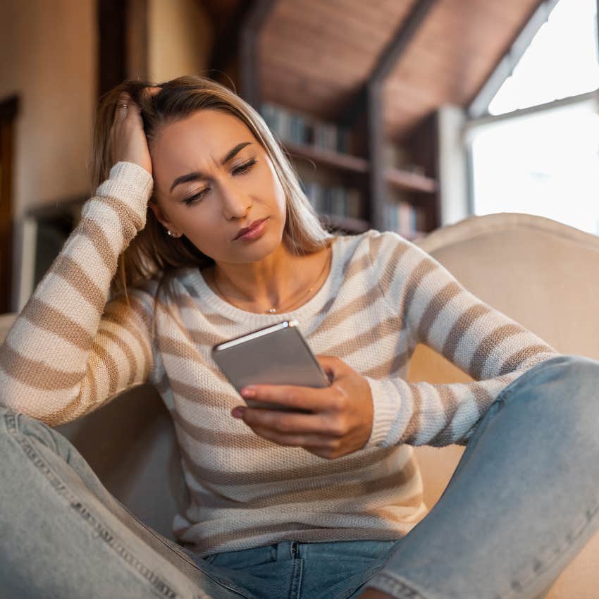 woman sending text to partner that says we need to talk that makes them pull back