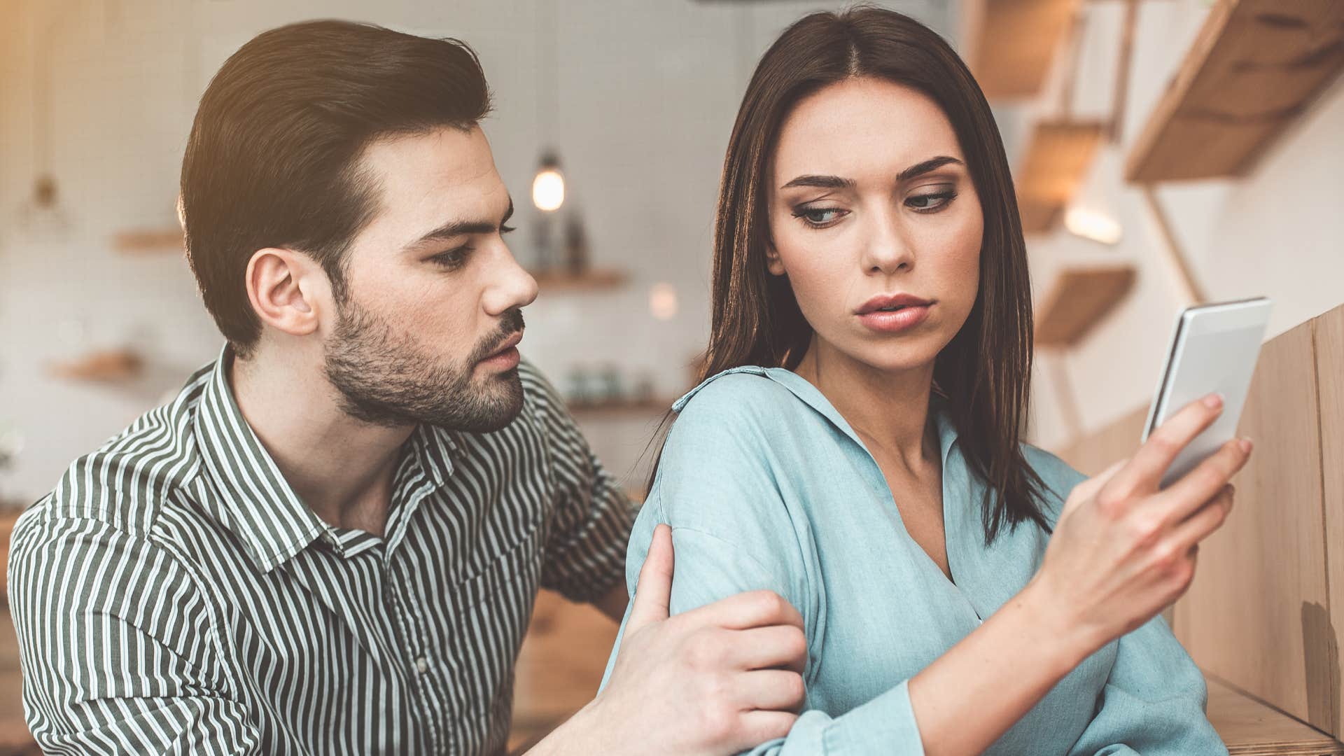 woman with her back to man finding it hard to forgive him