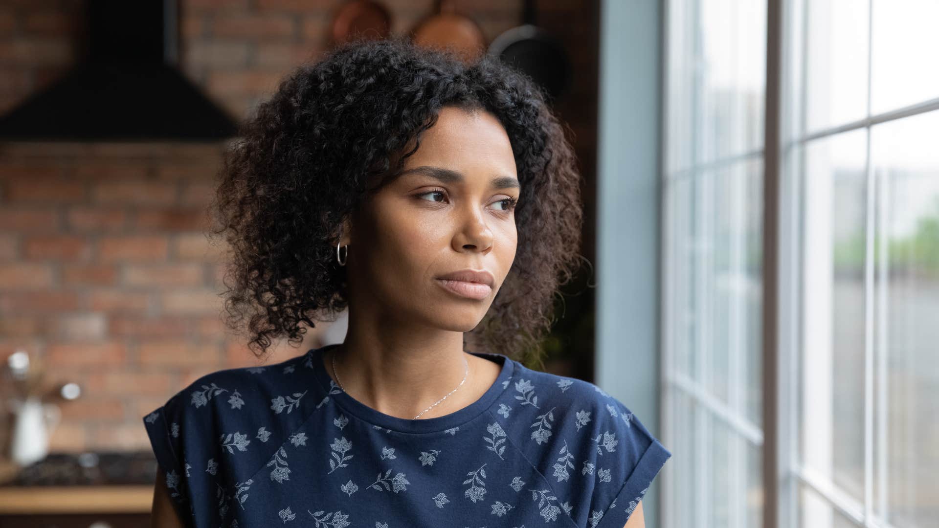 woman overthinking her past decisions looking upset