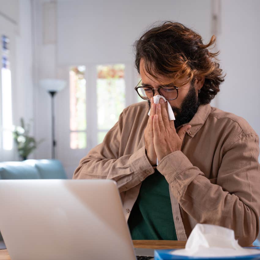 man who has the evil eye as he can't stop sneezing
