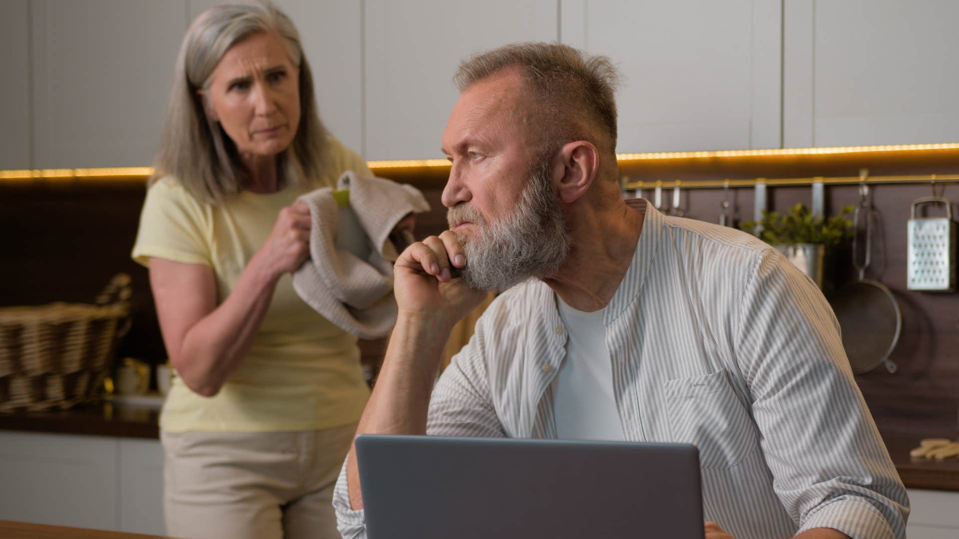 Man dealing with relationship strains while working at home.