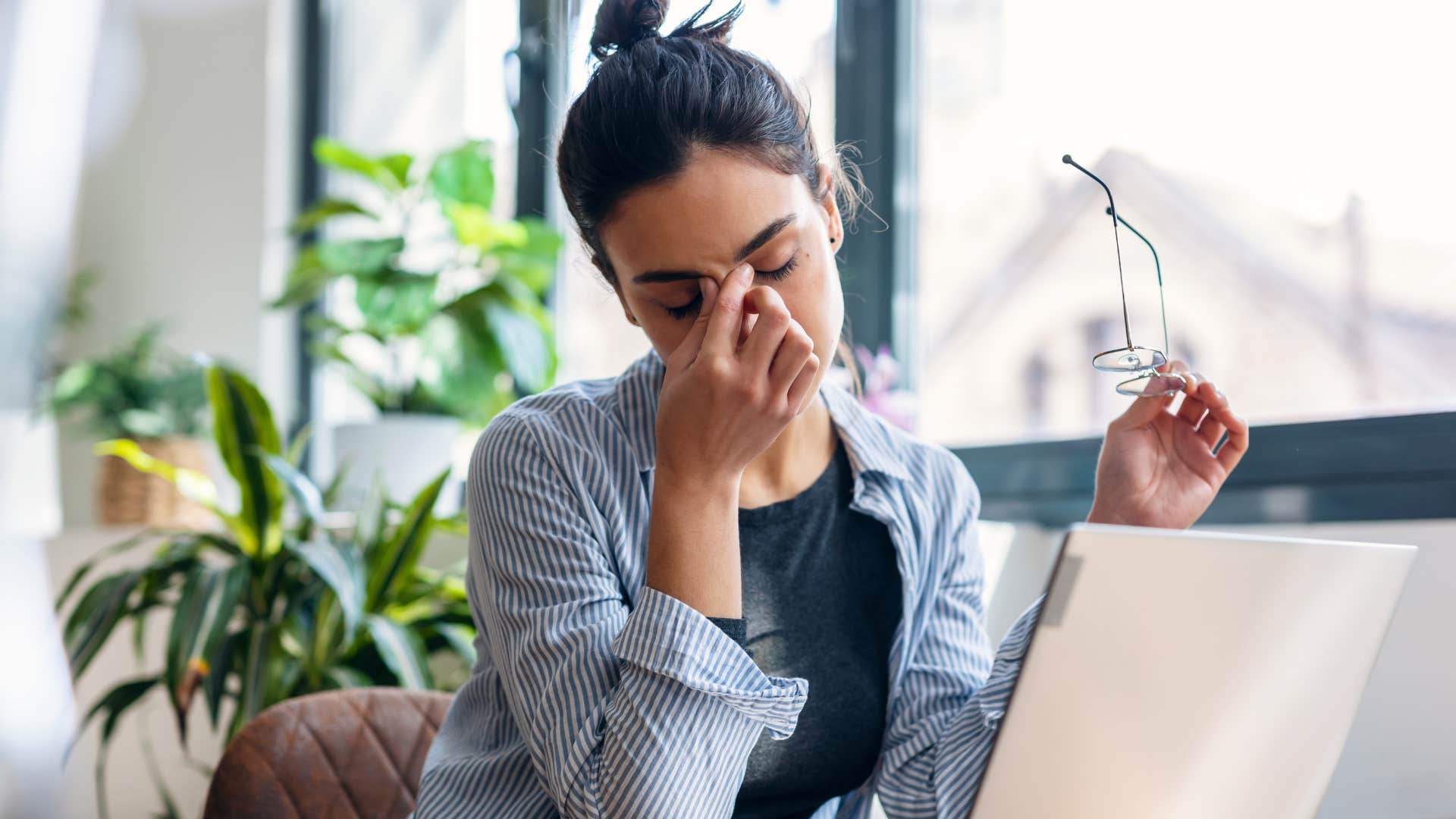 Woman who's feeling physically exhausted all the time at work.