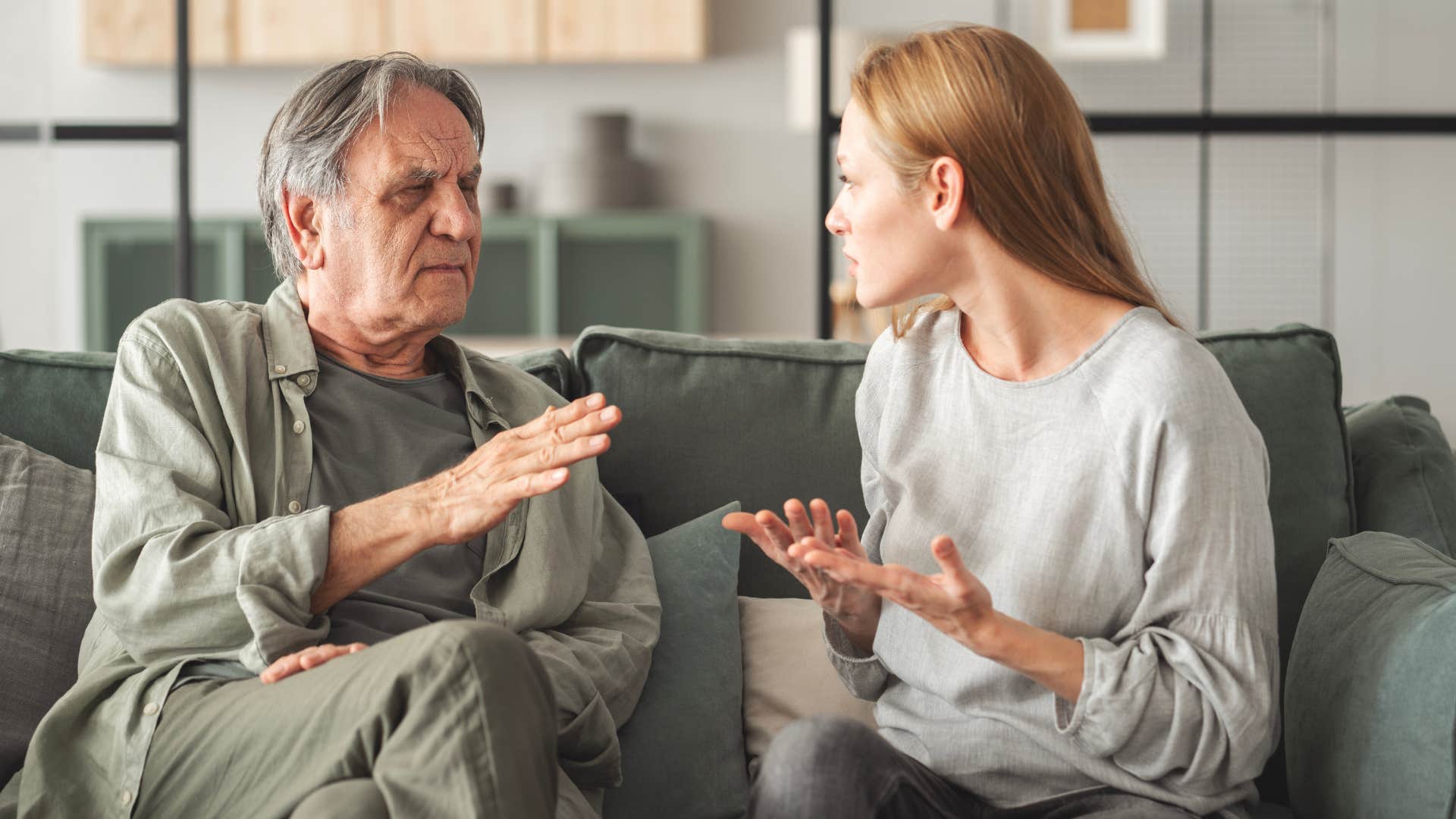 woman arguing with her dad on couch