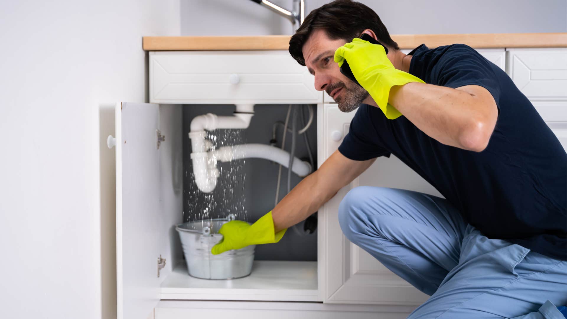 man with broken and half-finished projects at home
