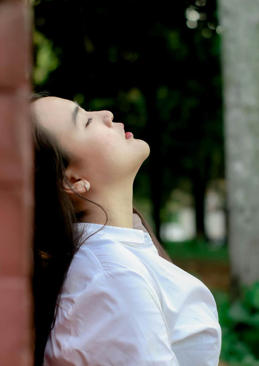 woman taking deep breath calm herself down