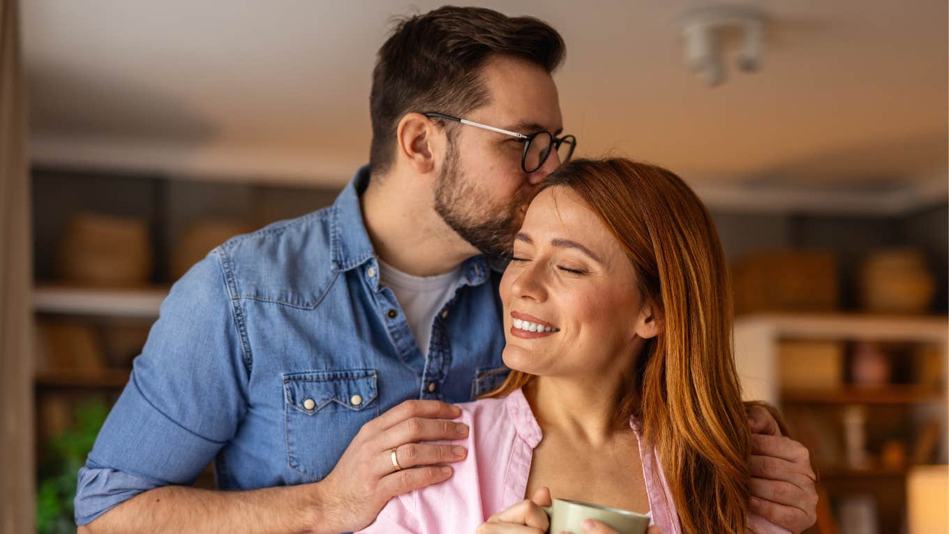 loving man kissing his partner's head