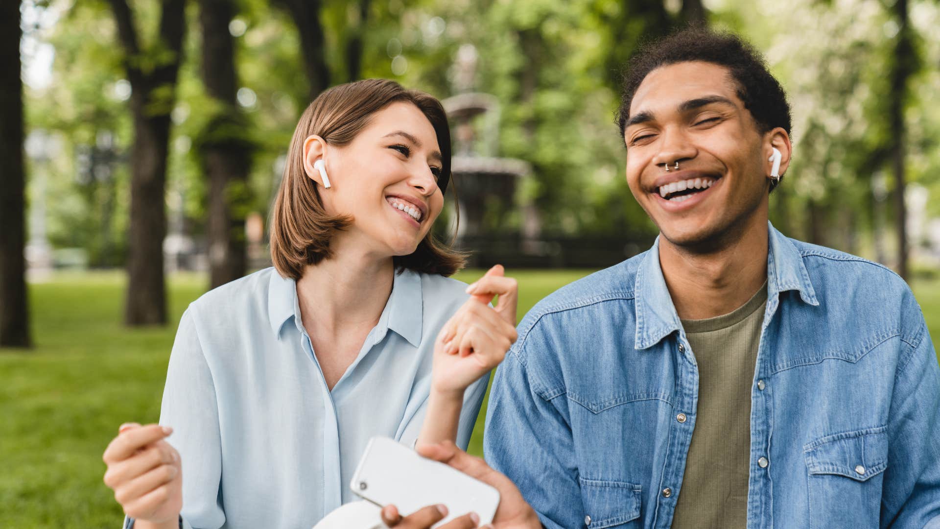 Healthy couple listen to podcast and laugh