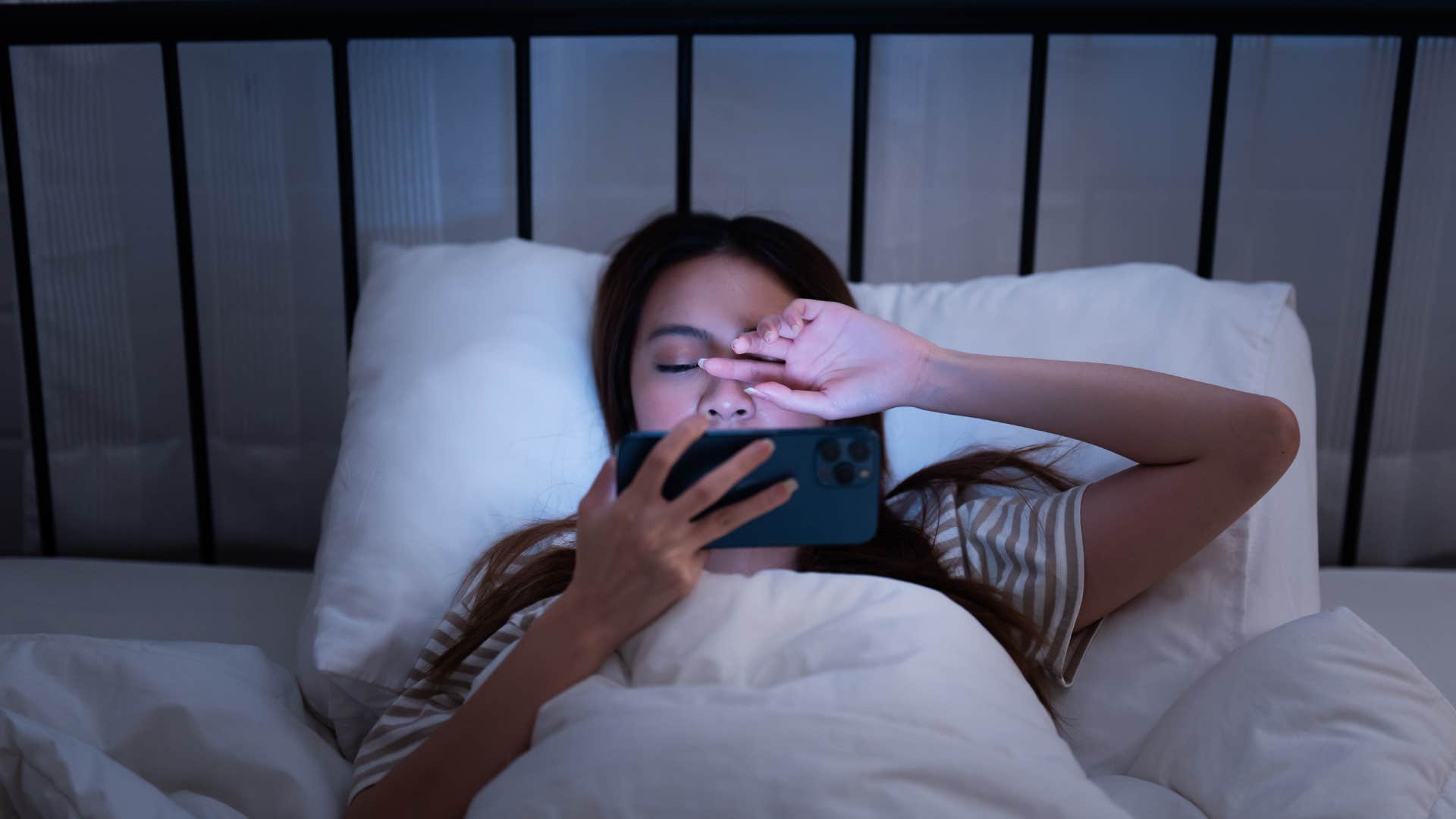 Woman who can scroll on social media from her bed.