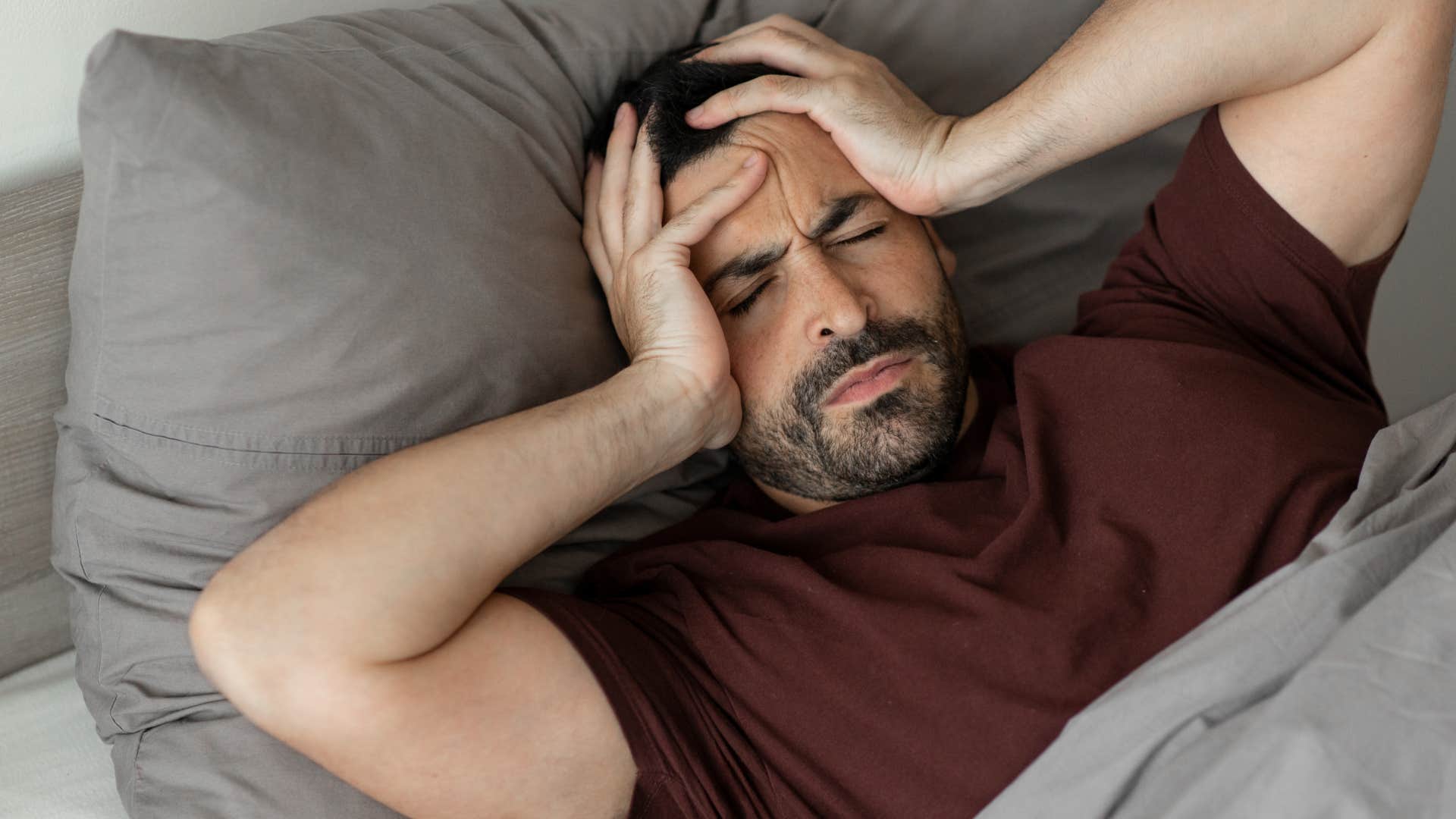 Man who skips movement sitting in bed.