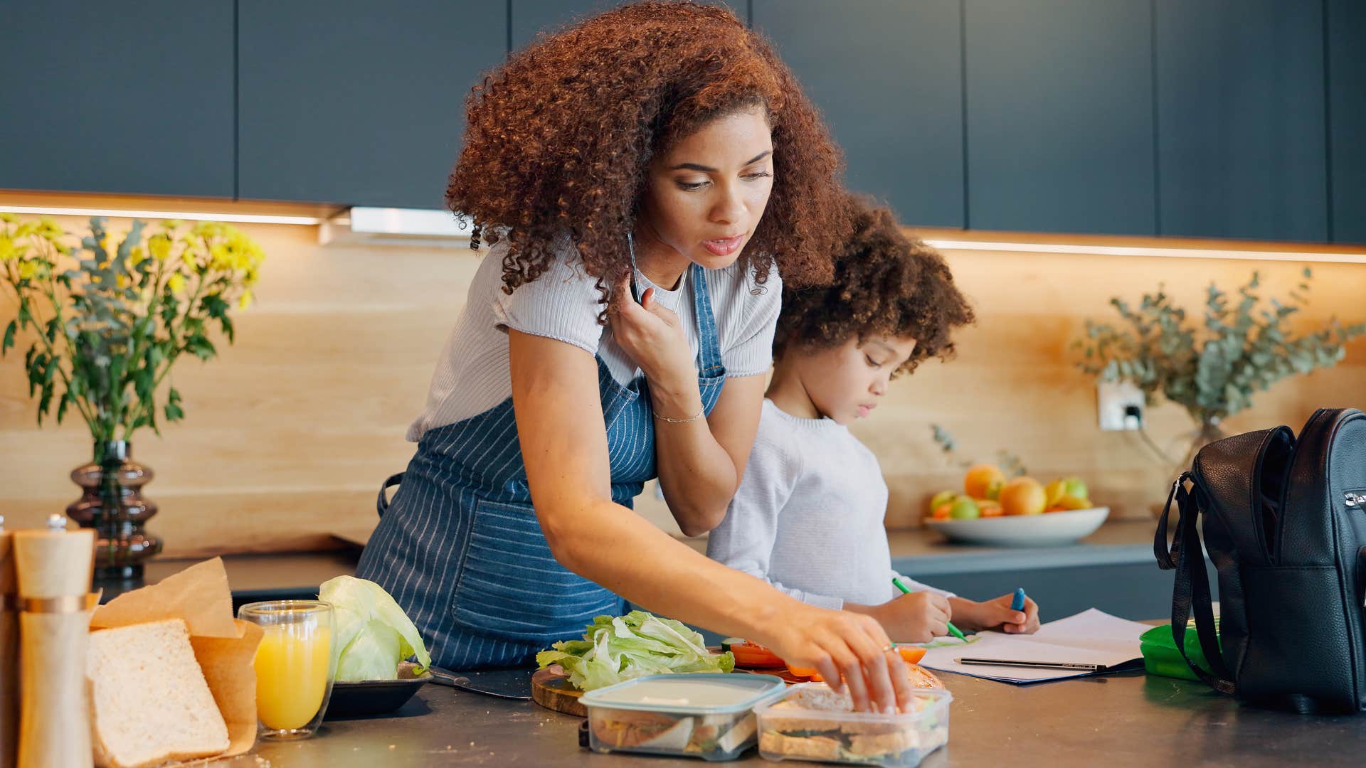 Woman who tries to multitask in the kitchen.
