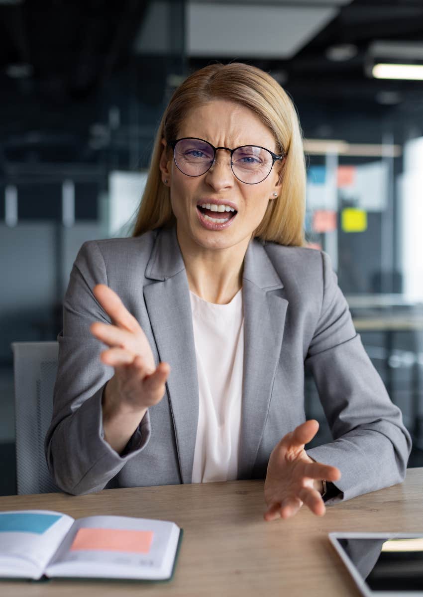 woman trying to control other people at work by yelling at them