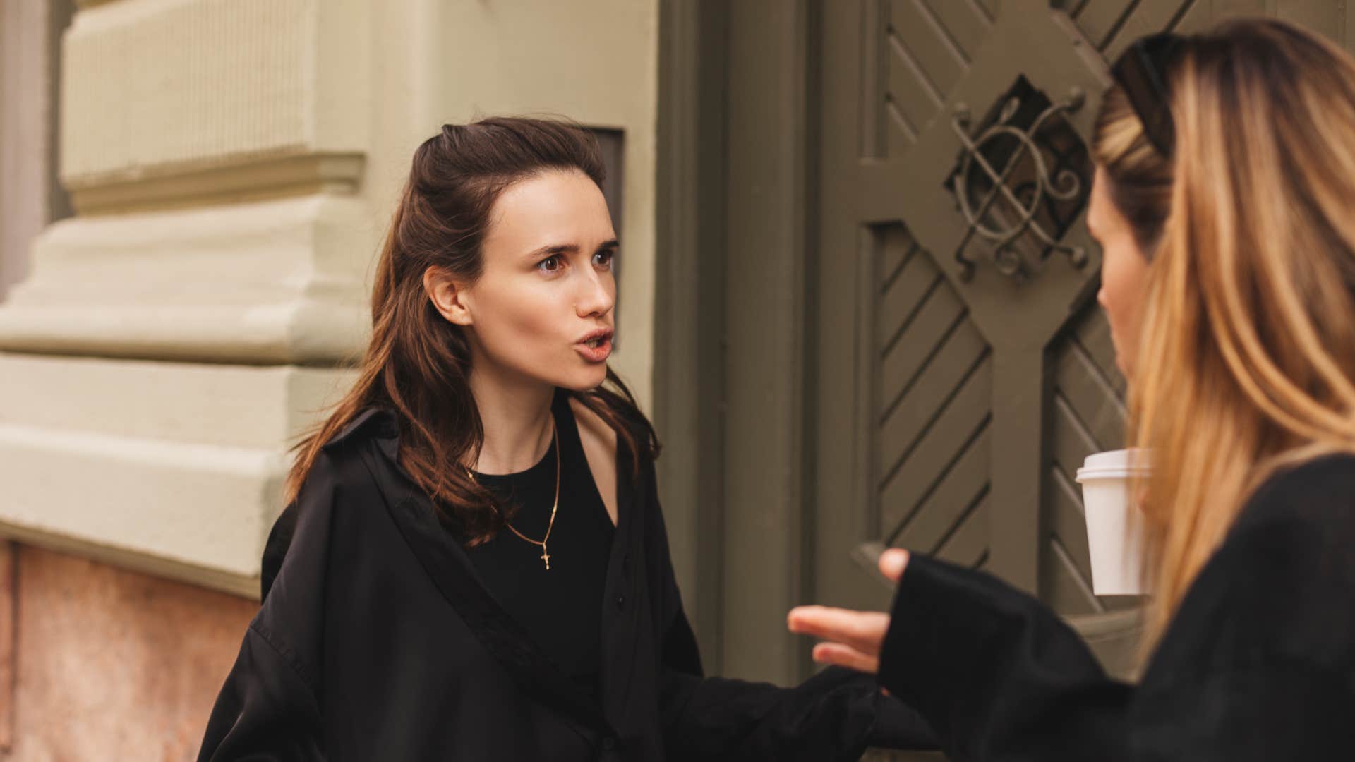 friend in black shirt arguing with friend as she expected her to read her mind