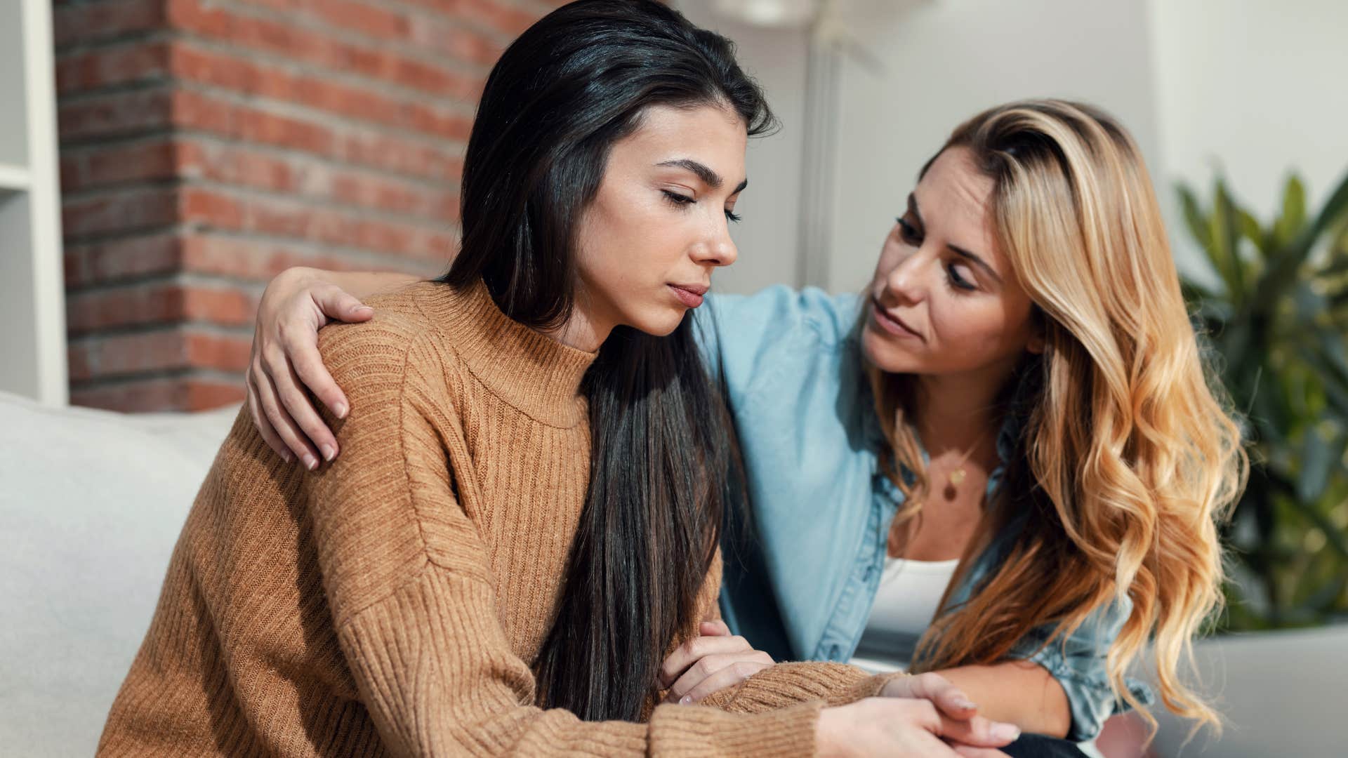 woman comforting friend in brown sweater as friend expects her drop everything everything when she needs it
