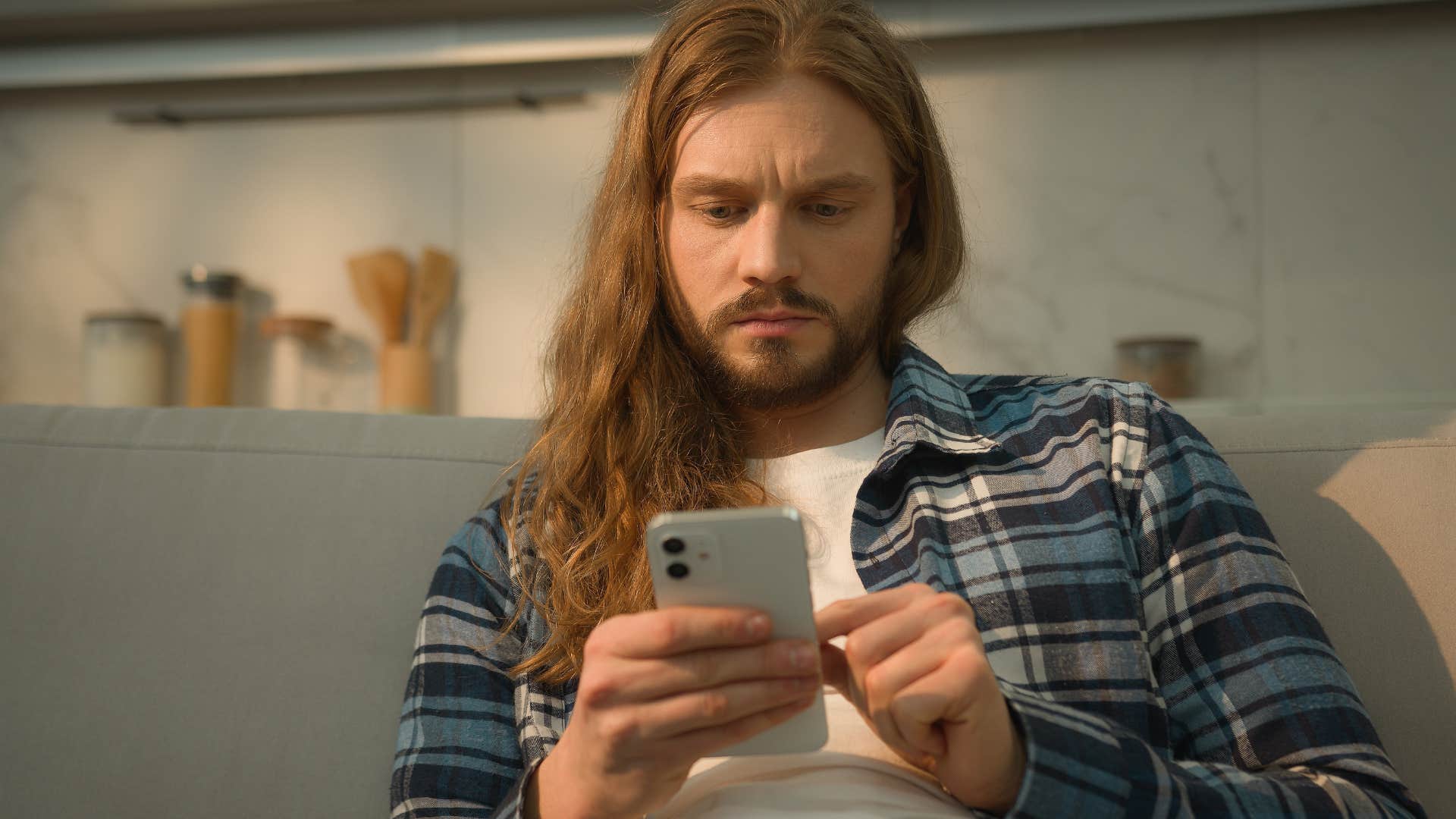 blindly accepting conspiracy theories things people with any sort of intelligence are super judgmental of man blindly accepting conspiracy theories and fake news on his phone