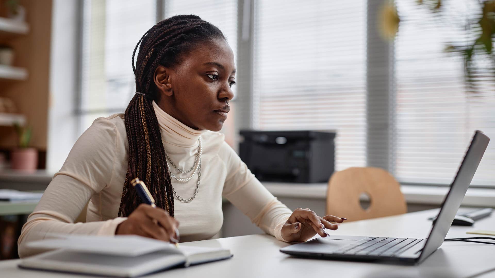 genius woman researching on laptop
