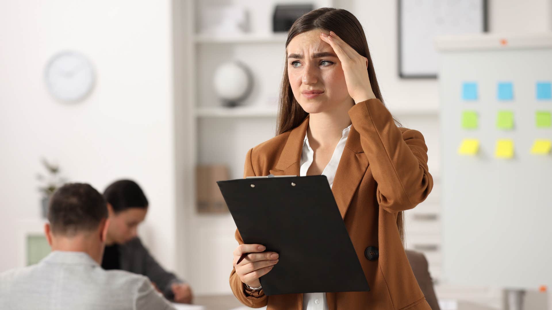 woman feeling embarrassed by mistake at work