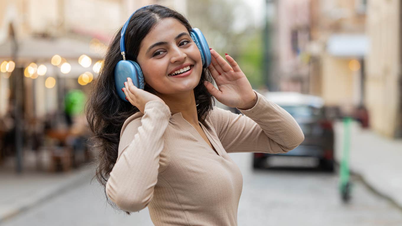 intelligent woman listening to music to calm herself
