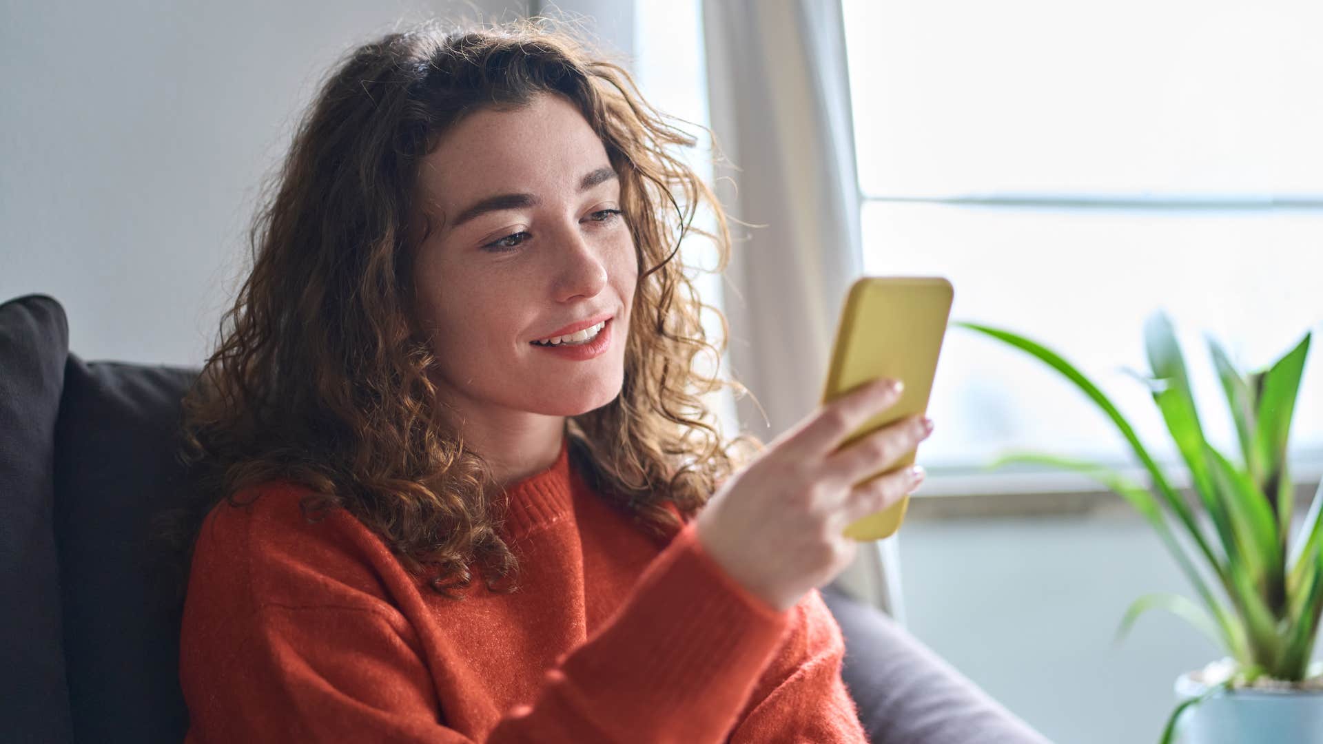 woman looking at her phone