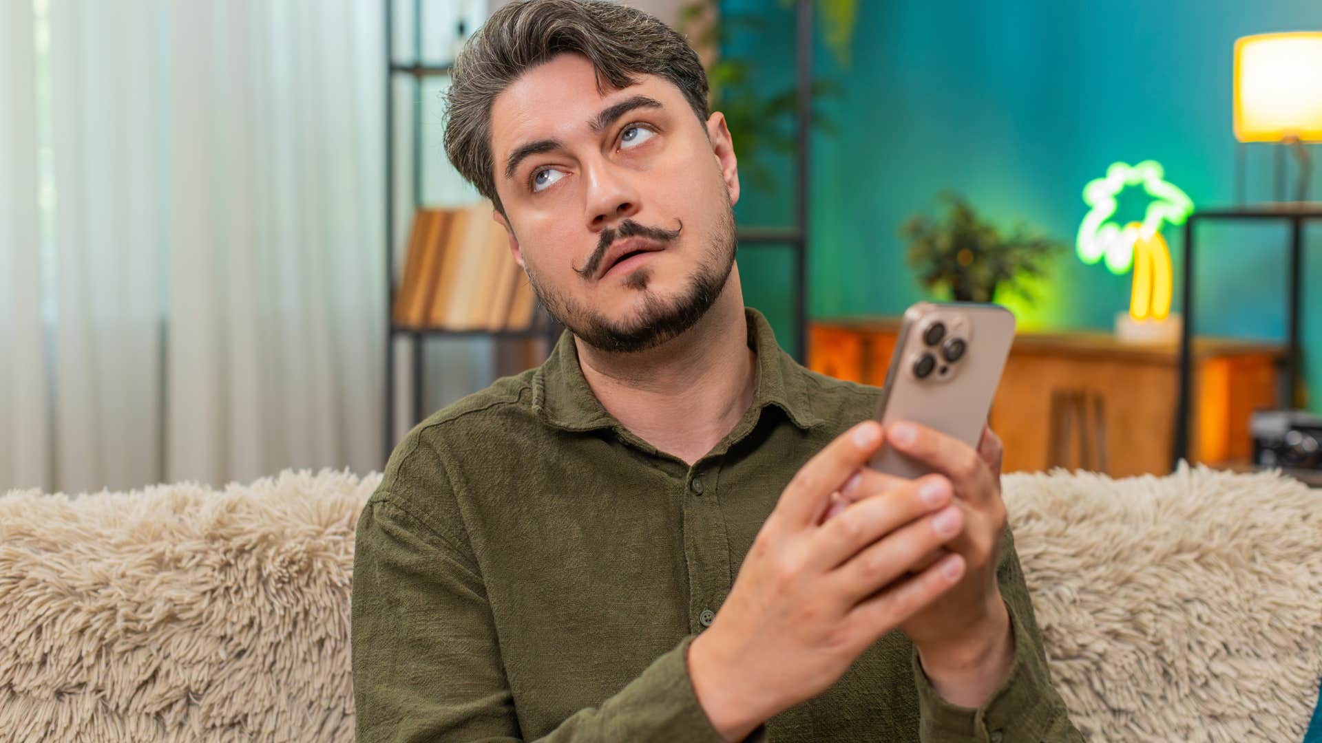 Man upset about being ignored on his phone.