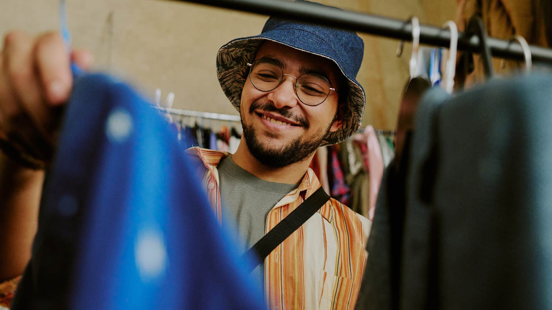 Man shopping at thrift stores.