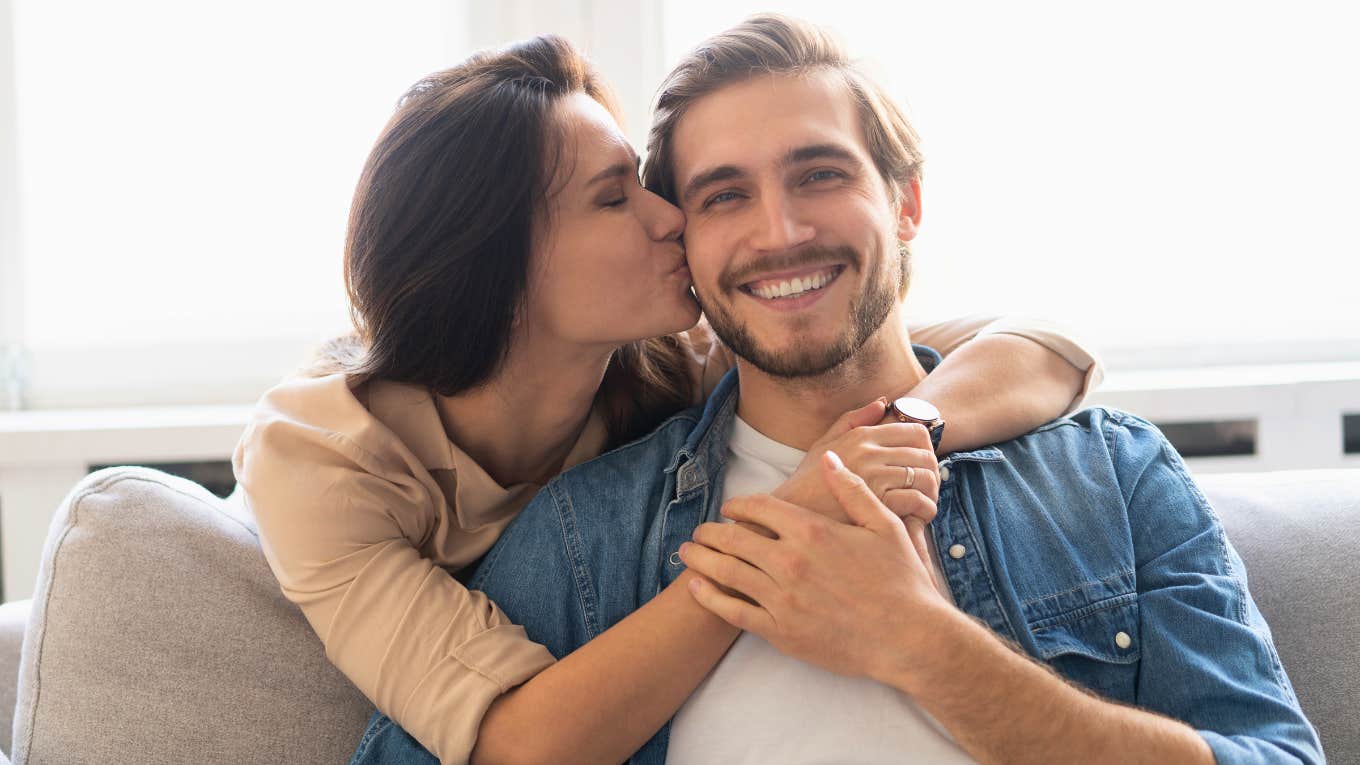 Things Wives Should Always Expect From Their Husbands, No Matter What happy wife kissing her loving husband on the cheek