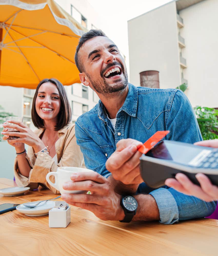 man tipping at restaurant