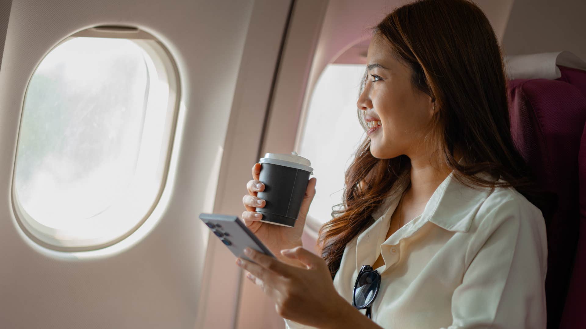 Woman with a second passport flying in a plane.