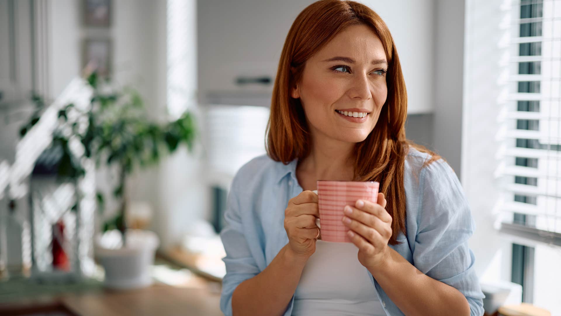 woman drinking beverage from curated bar cart