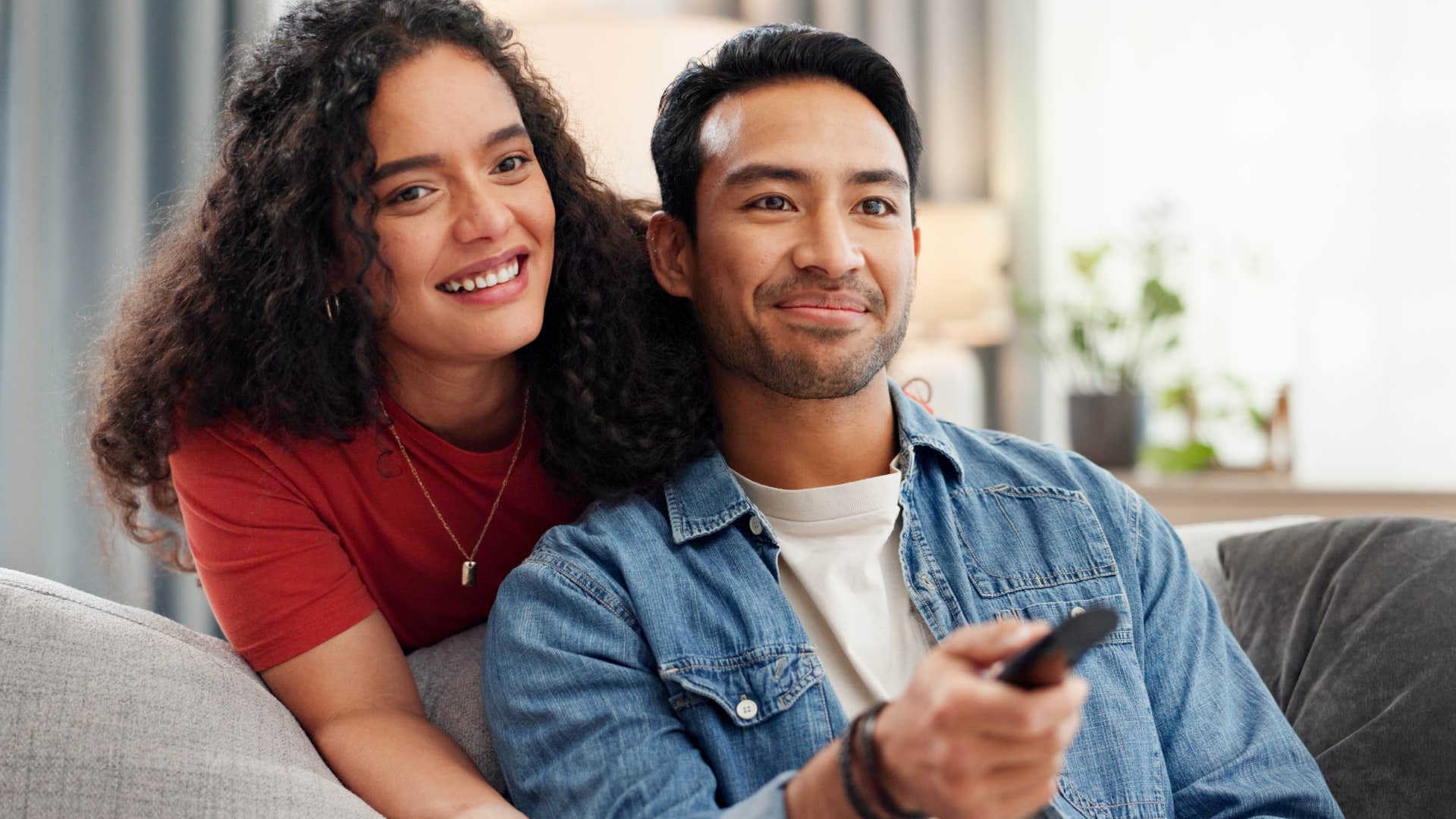couple watching streaming services on tv