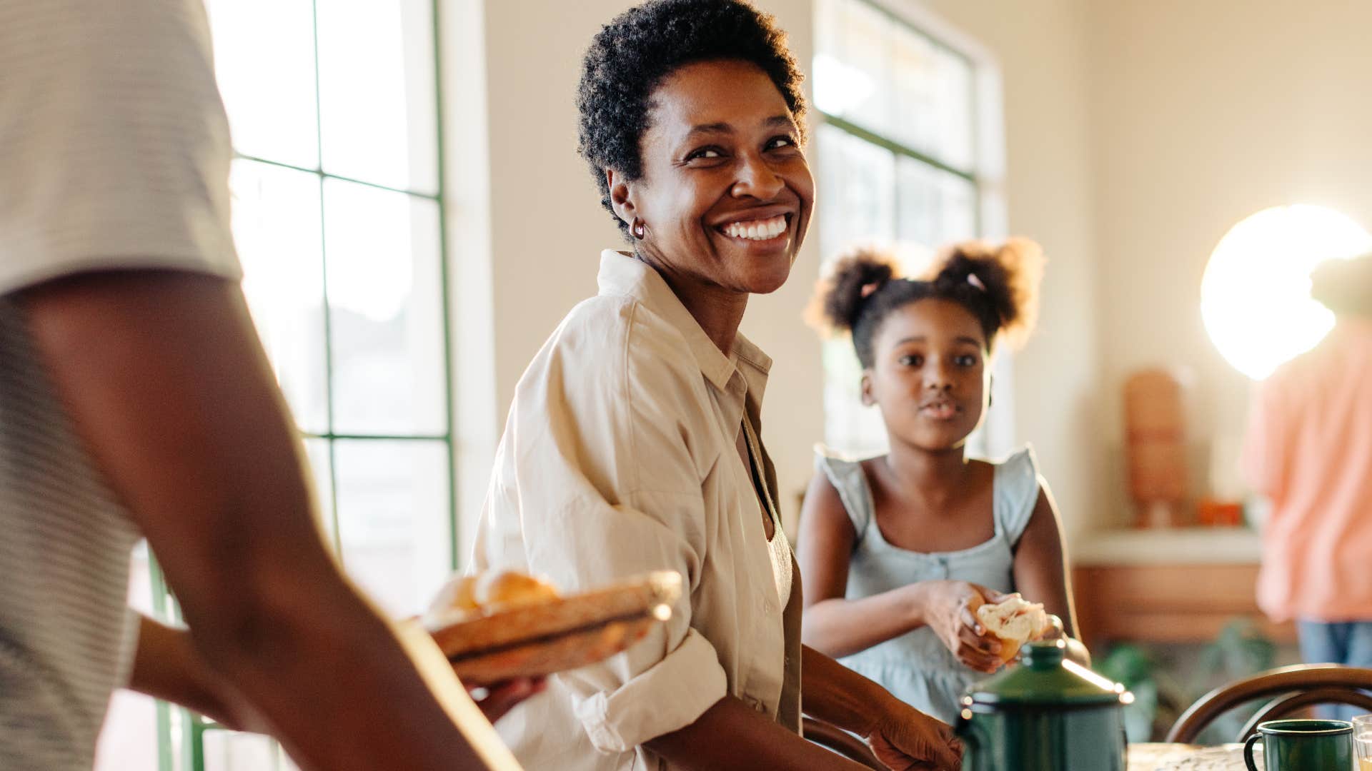 family sitting in kitchen together