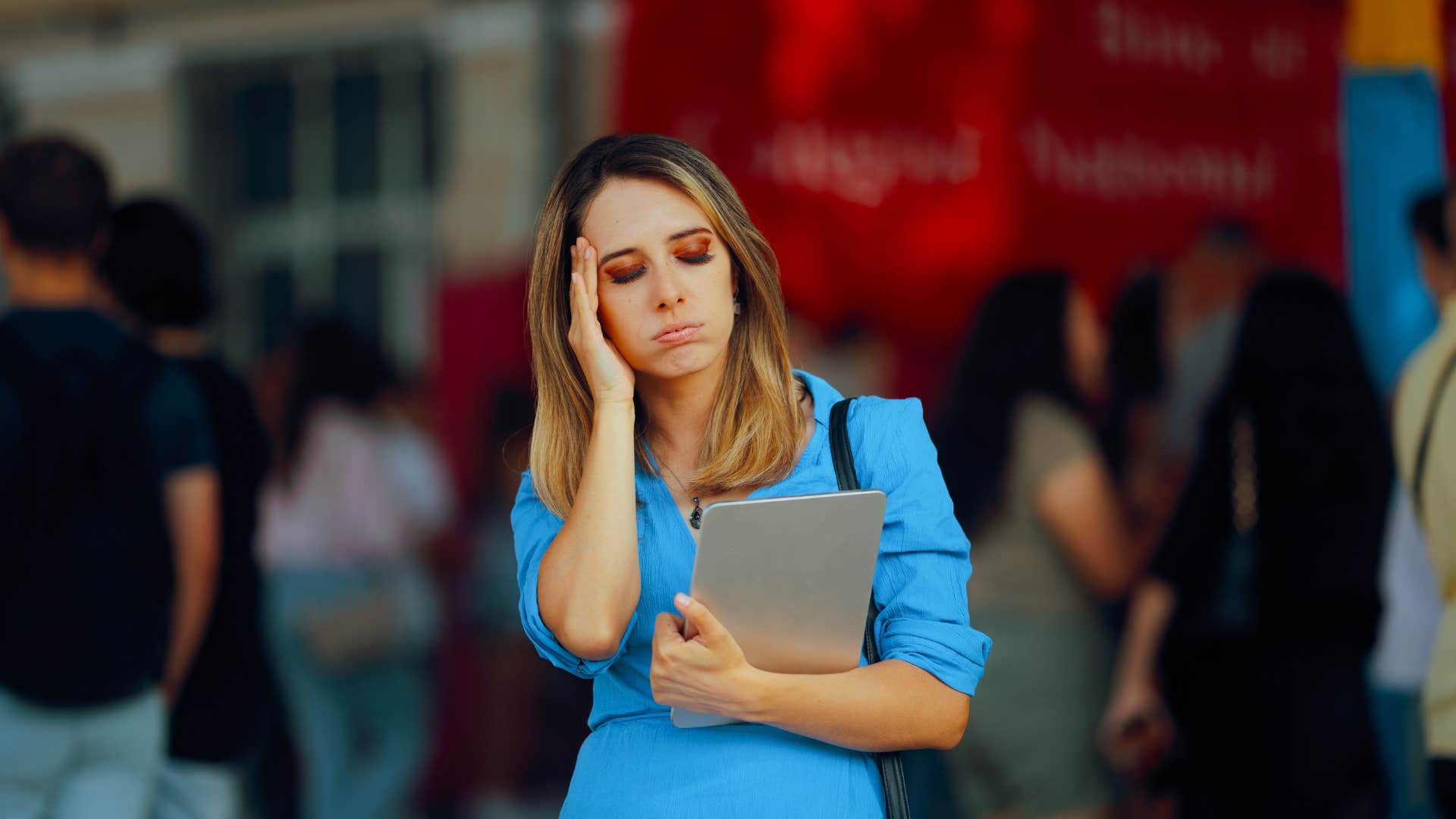 woman who is highly sensitive and easily overwhelmed in a crowd