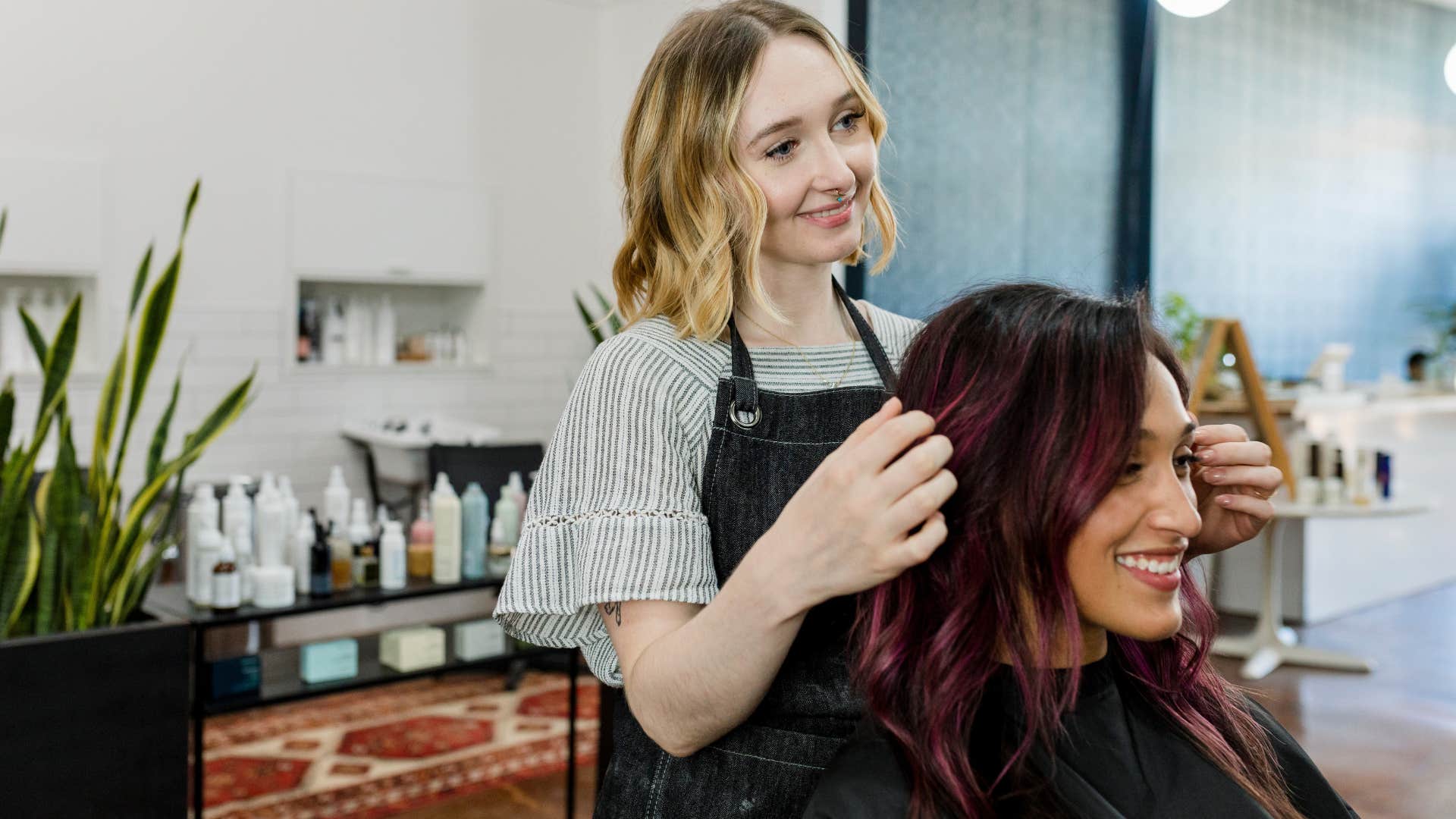 effortlessly compassionate woman doing hair for a friend