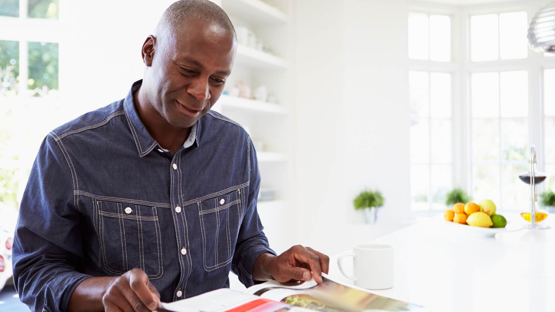 man who's emotionally logical reading a magazine