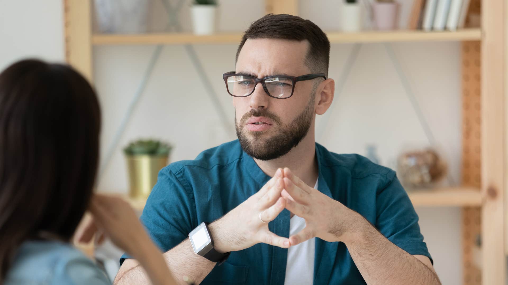 man having a follow up conversation with his colleague