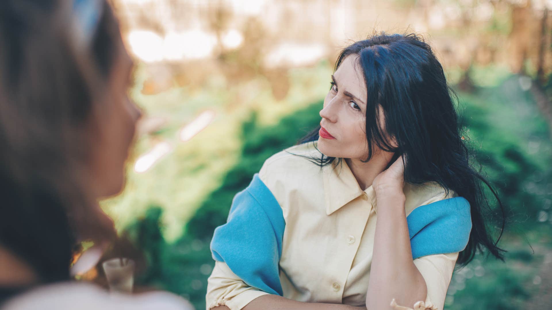 woman talking to friend not being heard