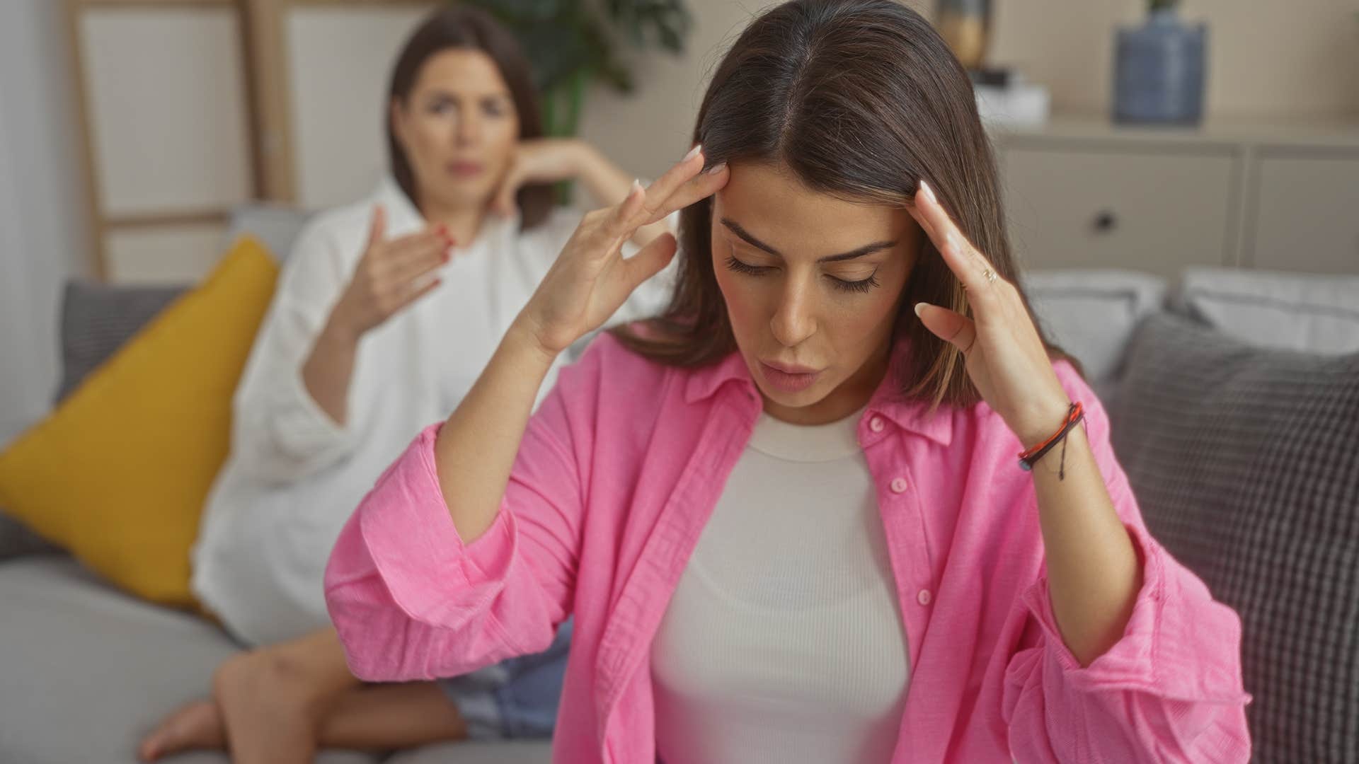 woman turned away from friend draining her emotionally