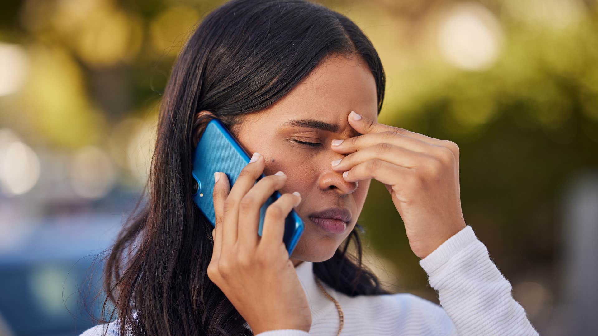 woman talking to her flaky friend on the phone