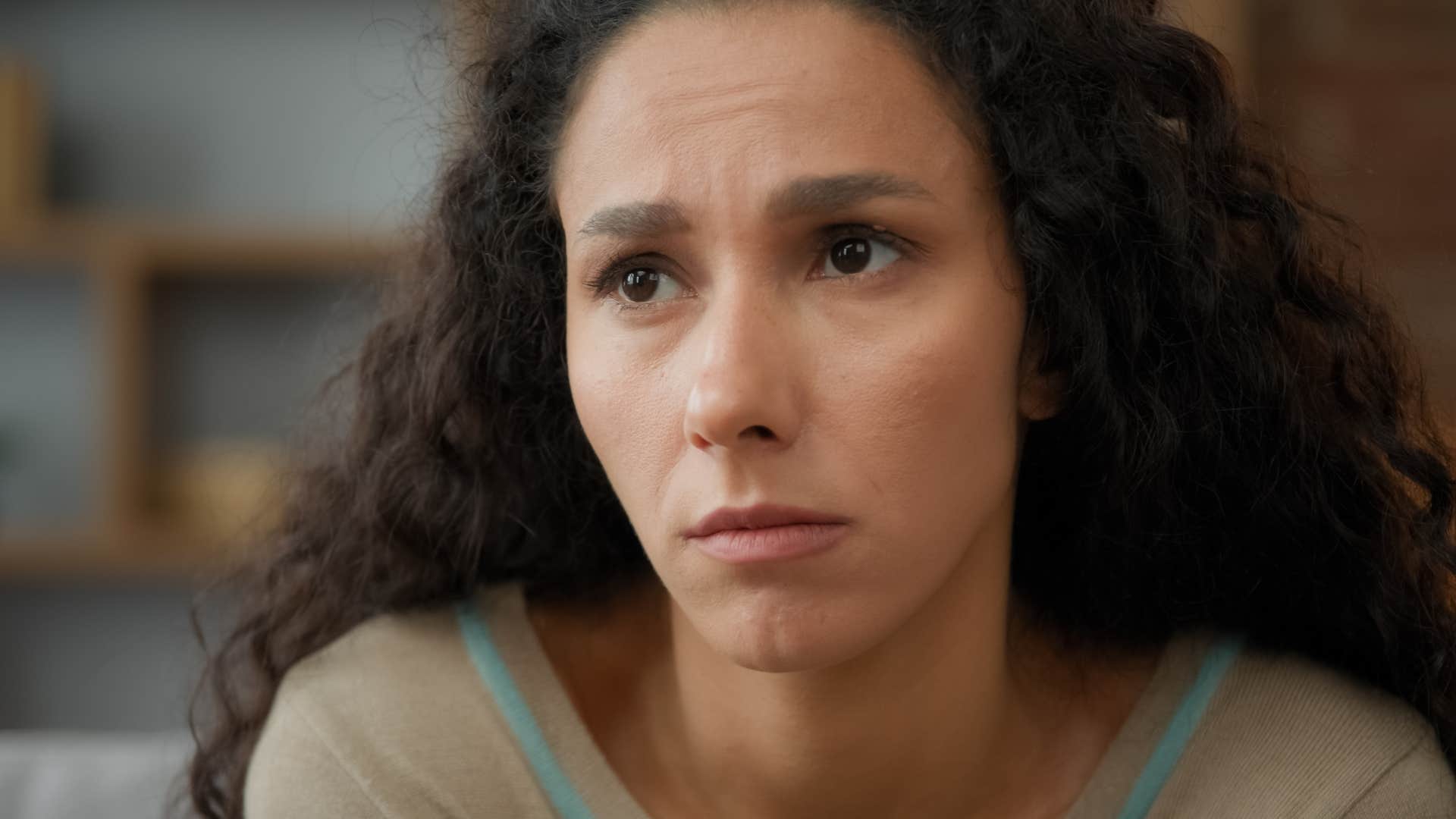 insecure woman looking sad