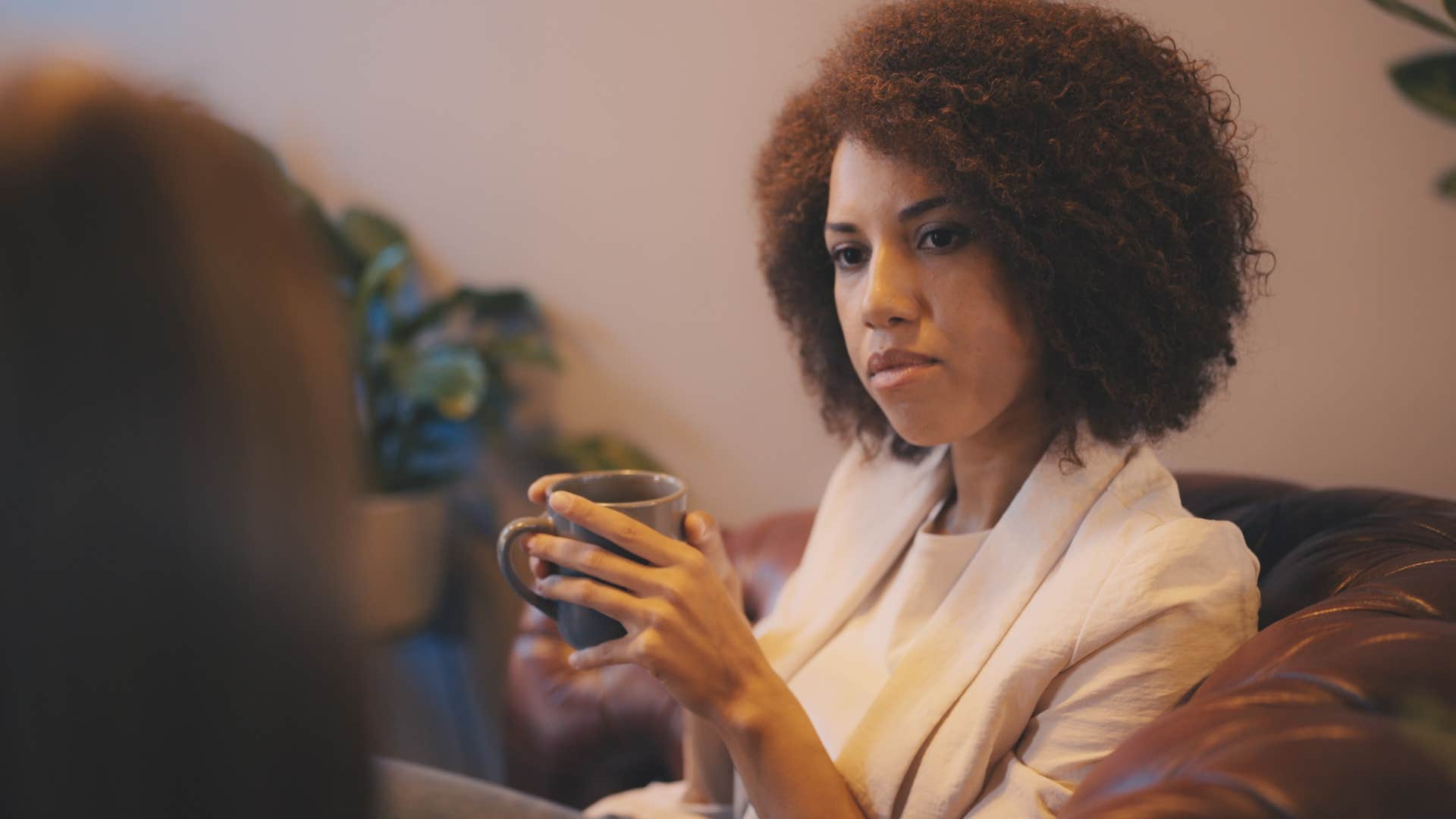 woman talking to a jealous friend