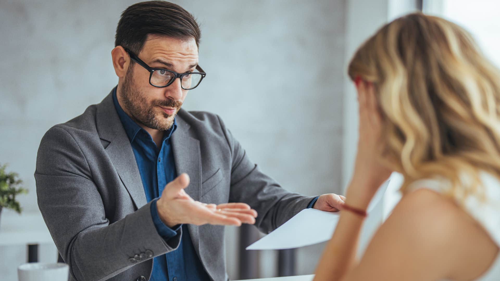 woman talking to a mansplainer at work