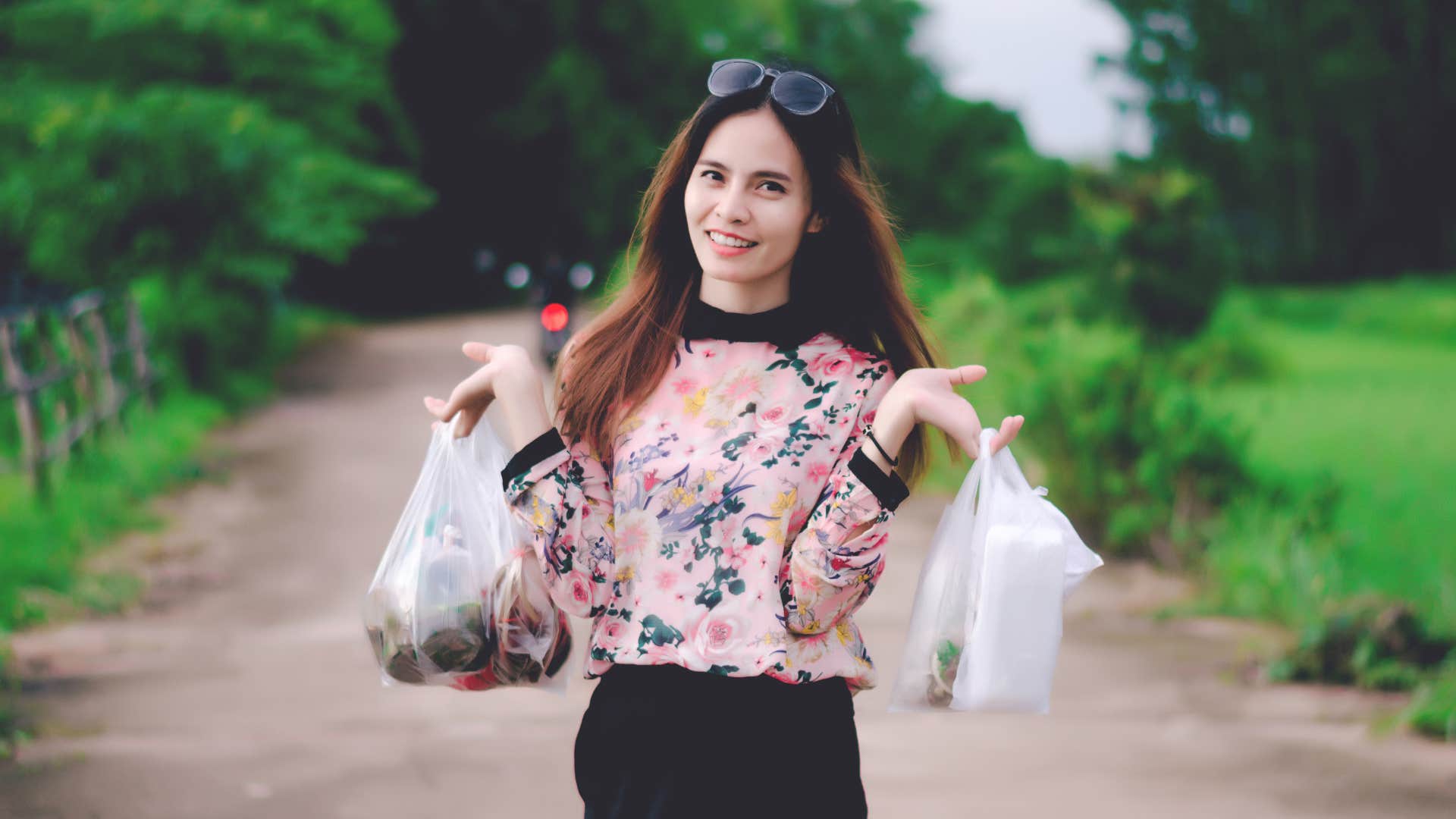 unnecessary free things people refuse to throw away because they might be useful someday grocery store plastic bags woman holding groceries in plastic bags to save