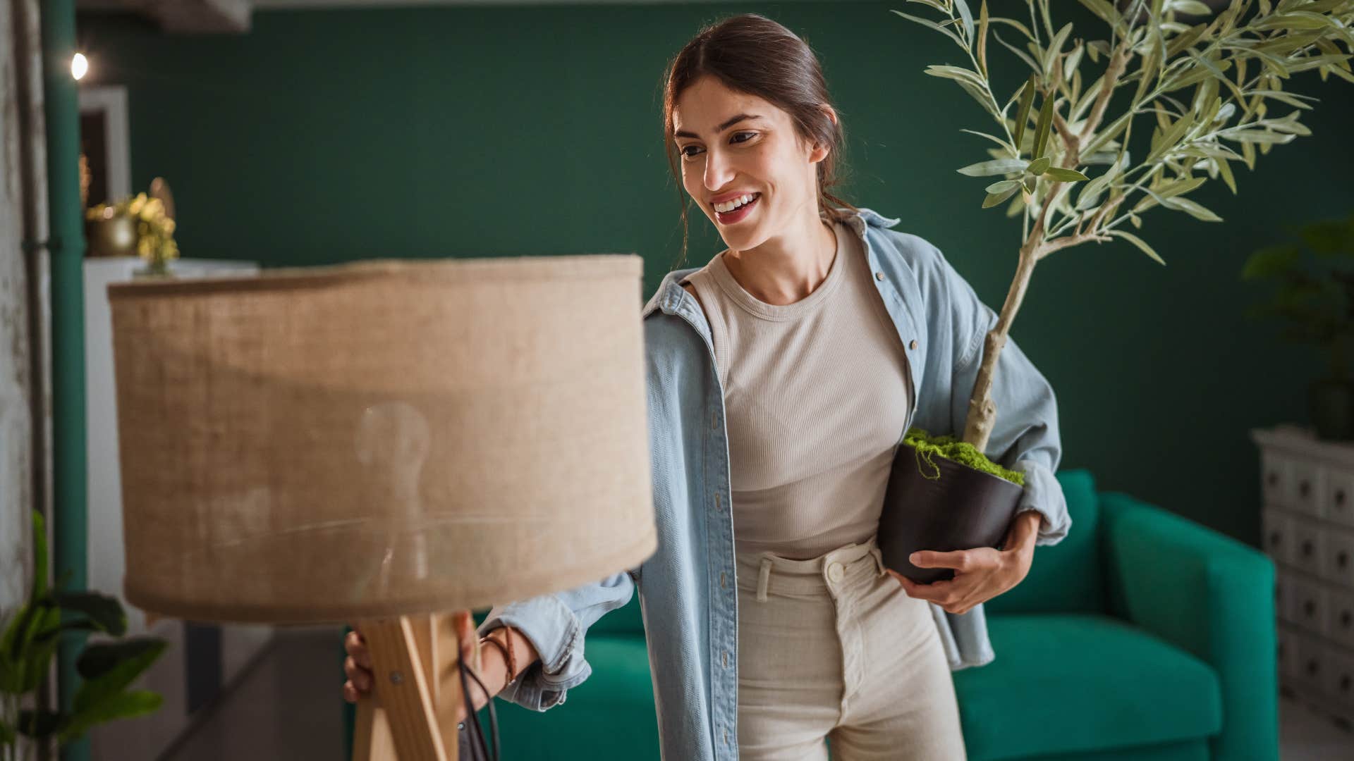 Woman who can rearrange furniture often smiling at home.