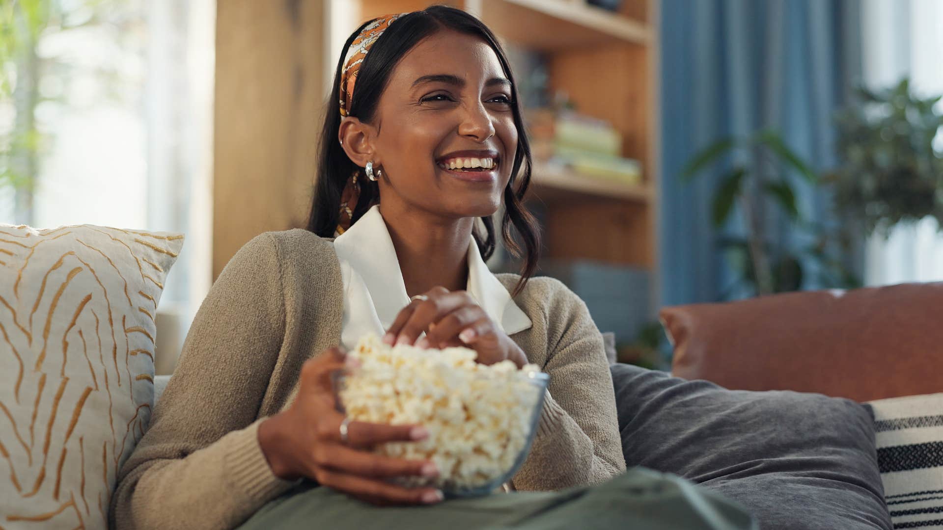 Woman who can unwind in a dedicated space sitting on her couch.
